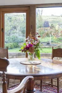 View from kitchen extension window with seating area