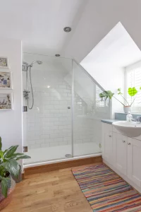 White bathroom with shower and plants
