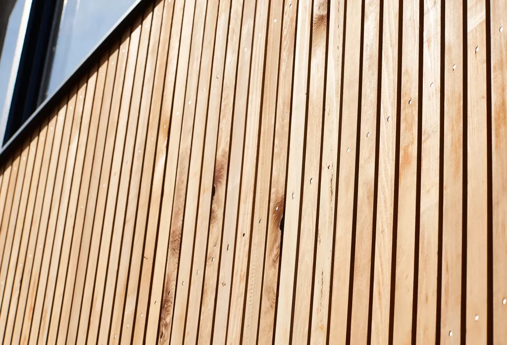 vertical timber cladding on the exterior of the property