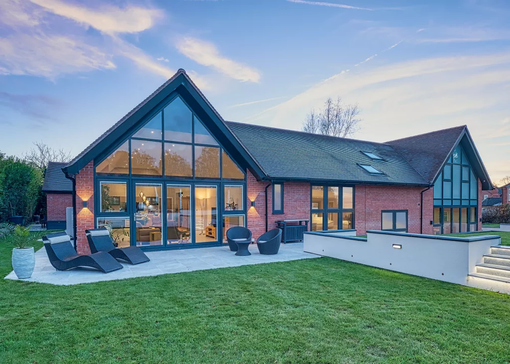 statement home with two large fully glazed gables 