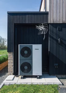 Air source heat pump on exterior of the property