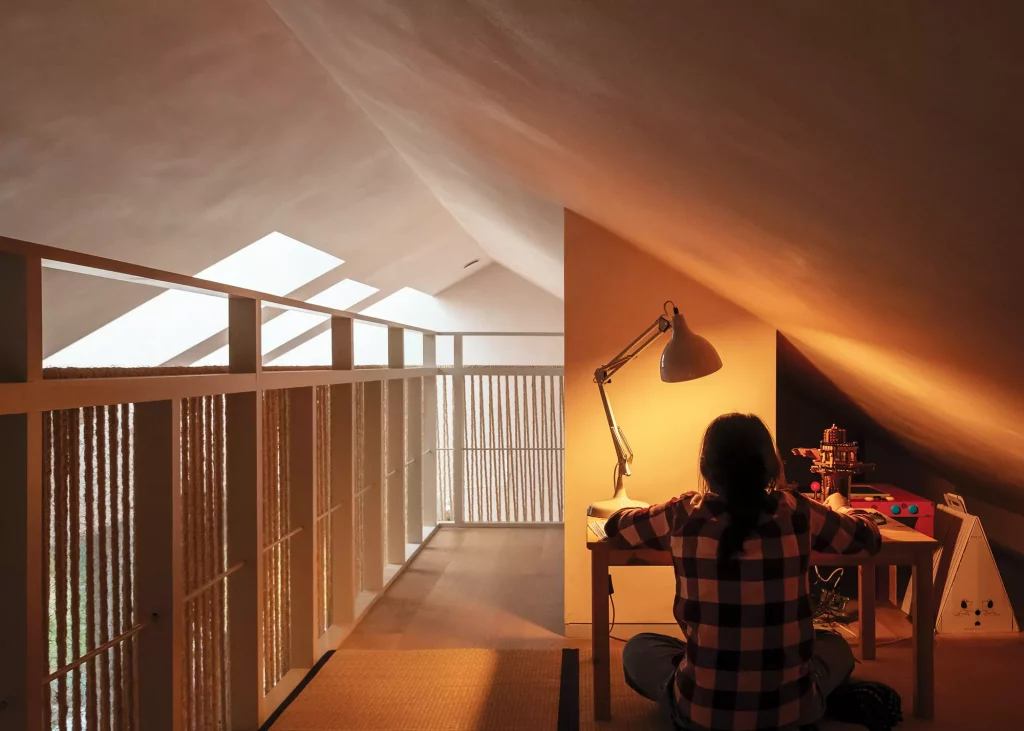 Mezzanine desk area looking over open plan living space 