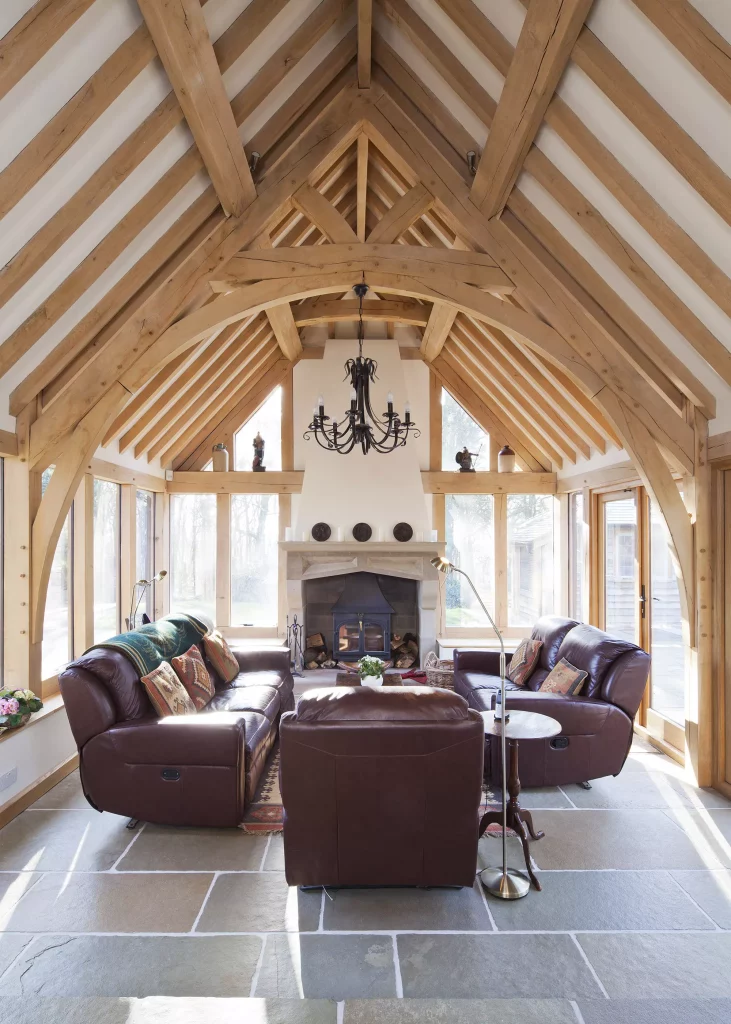 traditional style room with cruck truss frame in an arched design