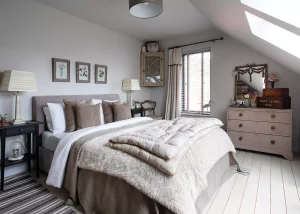 bedroom decorated with light furnishings and stone coloured paint