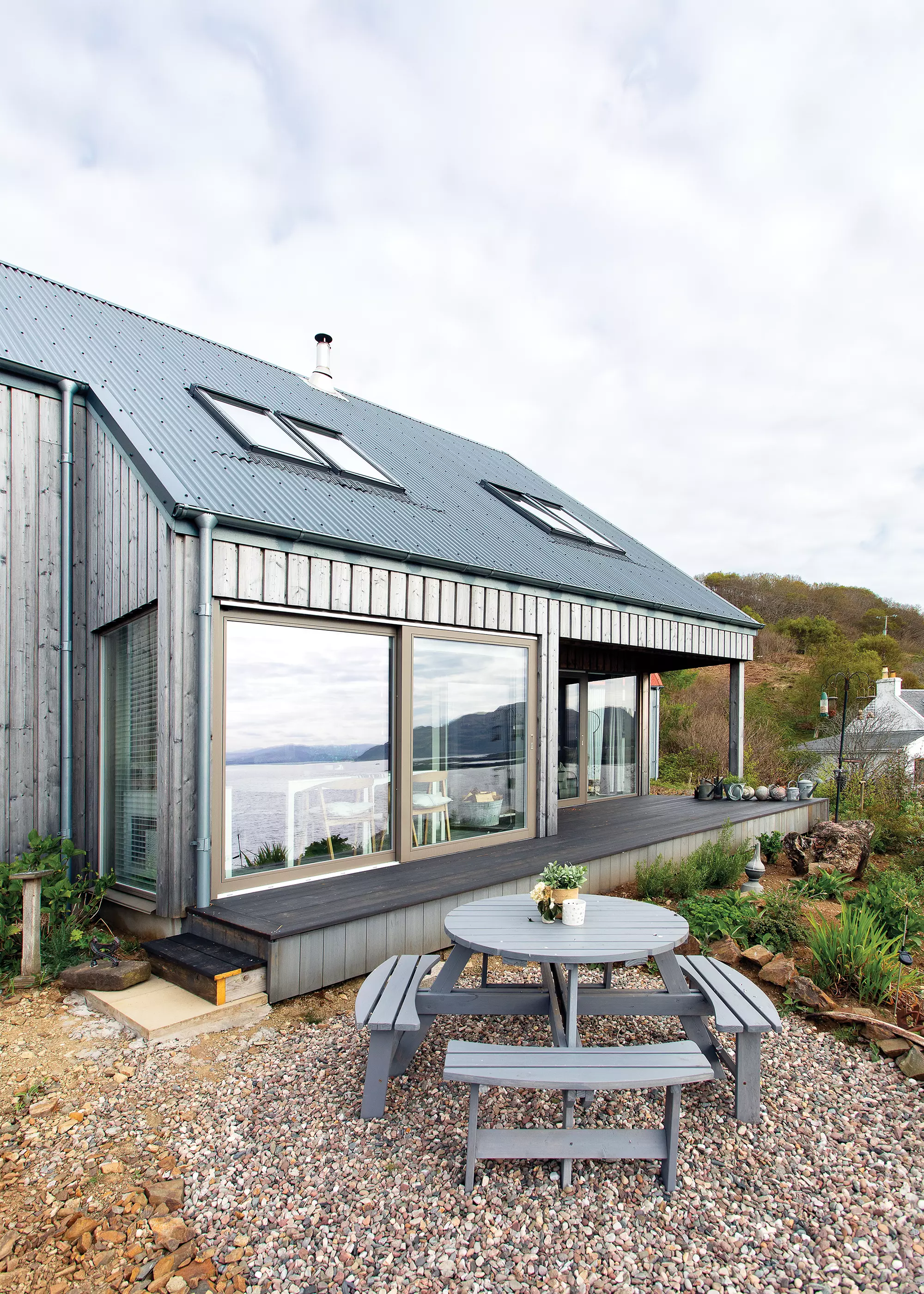 exterior of coastal self build home with Siberian larch cladding