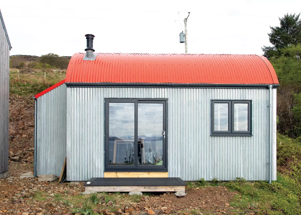 small holiday home cabin with red roof 