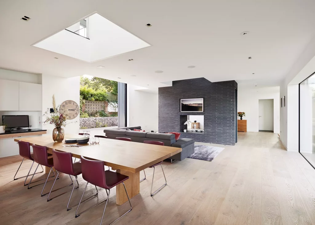 contemporary open plan living-dining area with large glazing 