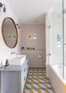 bathroom with geometric floor tiles and upcycled sink unit