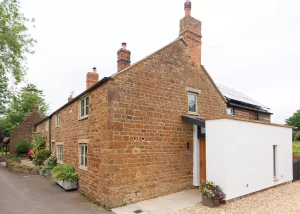 Red clay period cottage with alu-clad hardwood windows