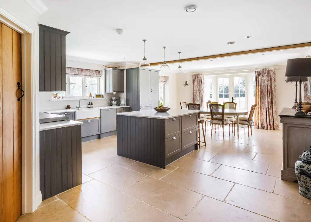 Traditional Shaker-style grey kitchen with large floor tiles