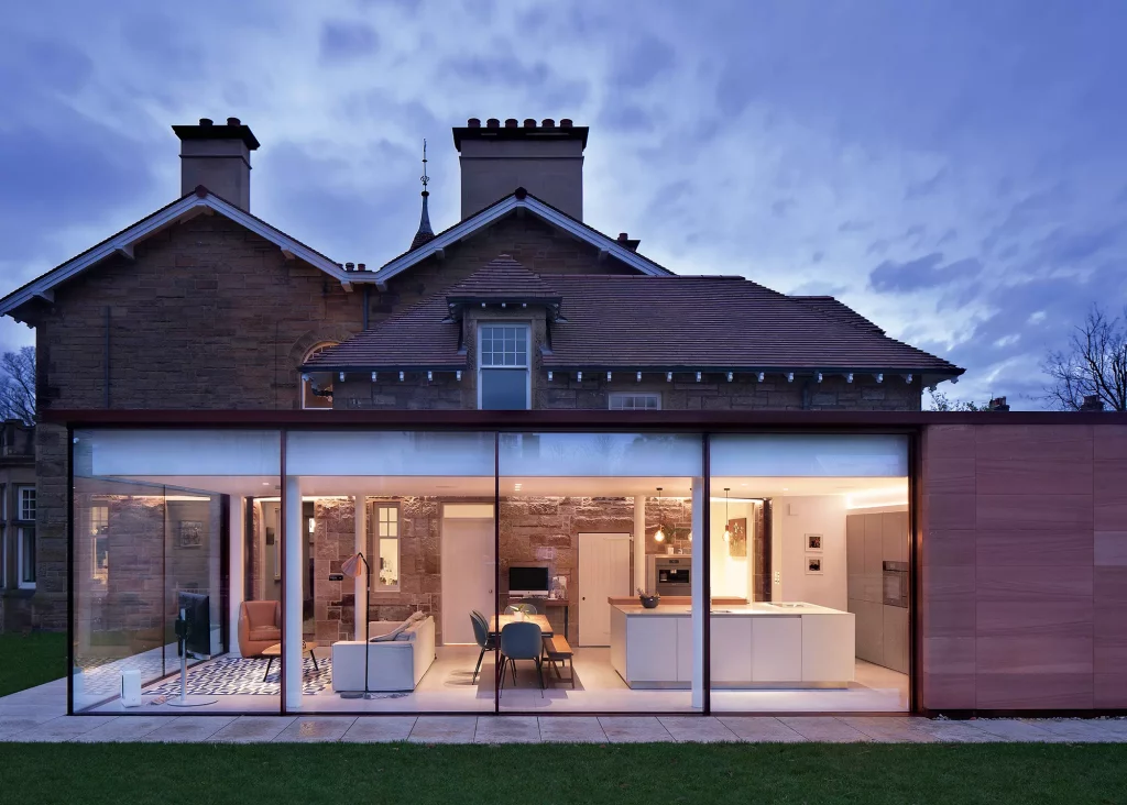 red sandstone and glass extension as an addition to a main grade B listed home in Edinburgh