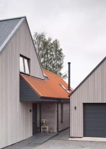 Timber frame self build with Siberian larch cladding and porch area