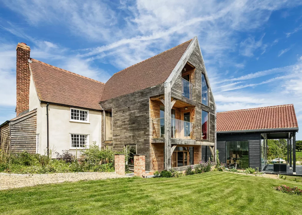 Oak frame extension to a listed farmhouse by Oakwrights