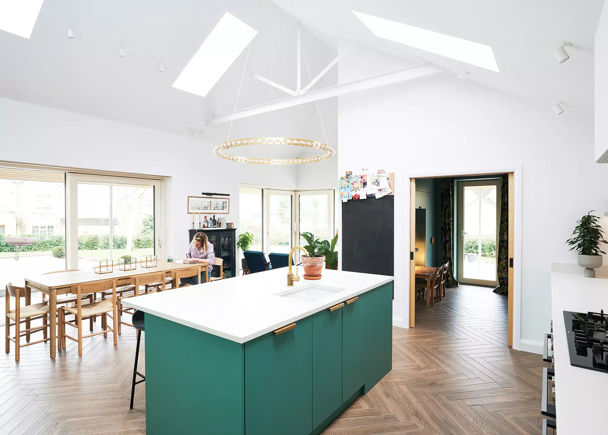 open-plan kitchen-dining-living space with large vaulted ceiling