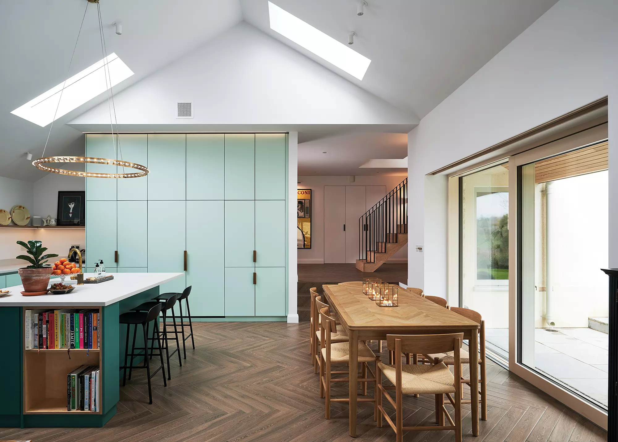 kitchen-dining-living area with rooflights and large glazed doors