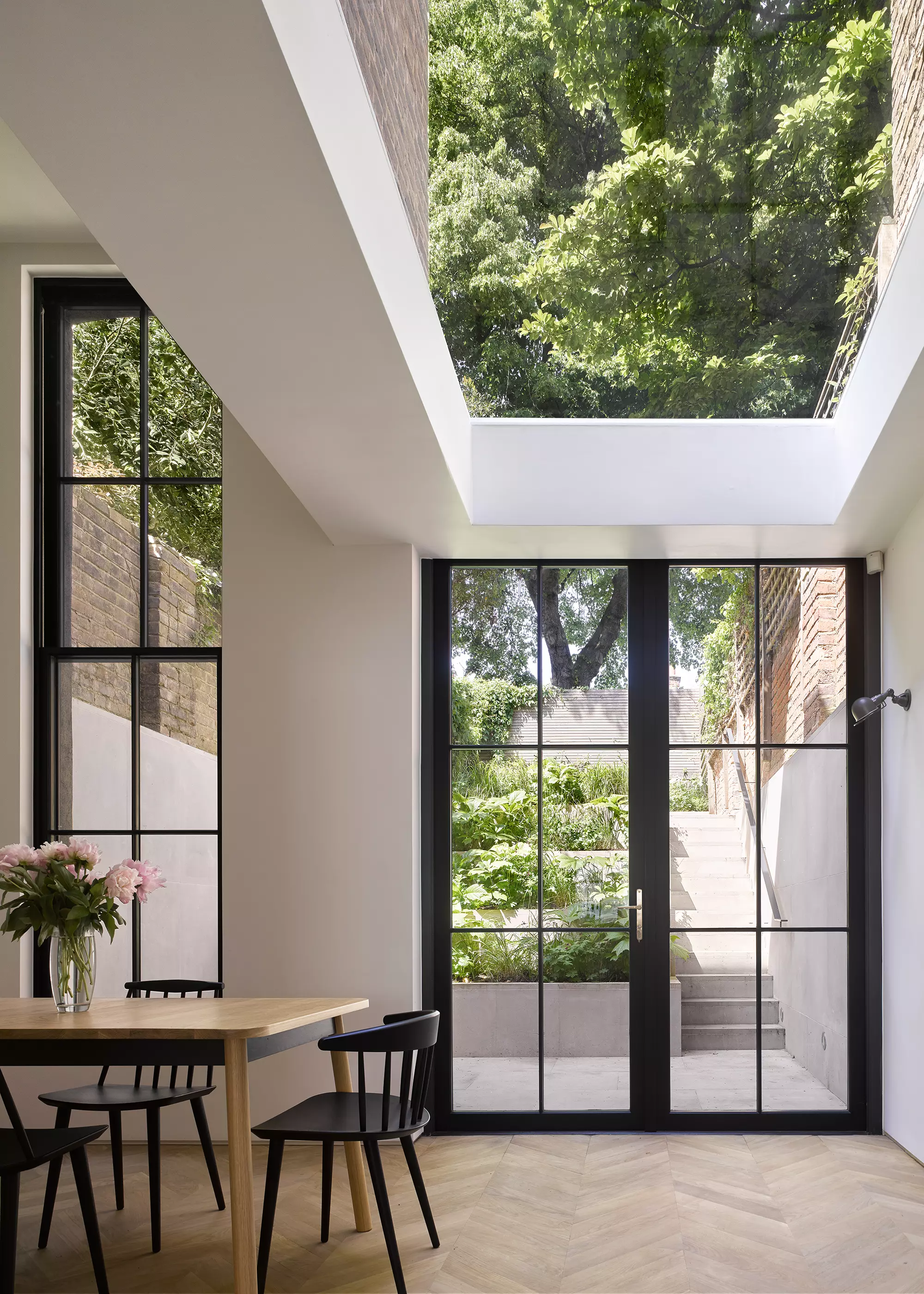 Dining room interior of two-and-a-half storey tower extension at the rear of 1830s grade II listed home in Islington