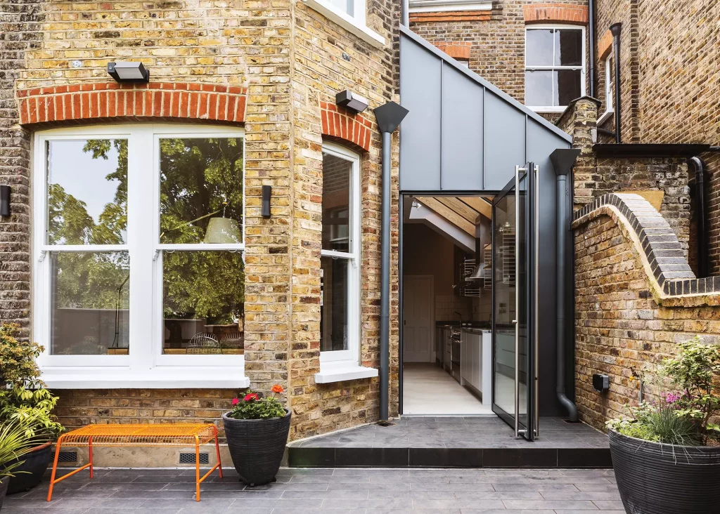 brick and contemporary style side return extension exterior with bay window