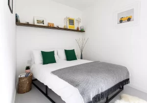 white bedroom with concrete floor