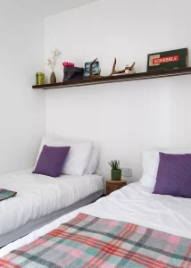 twin bedroom with white walls