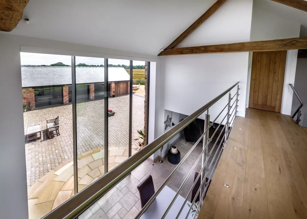 interior view looking out over the full-height double-storey glazed sliding doors