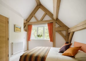 bedroom with exposed oak beams