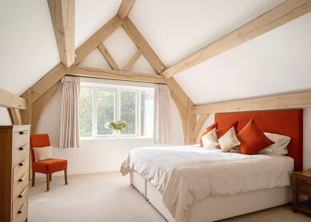 bedroom with vaulted ceilings and exposed oak beams
