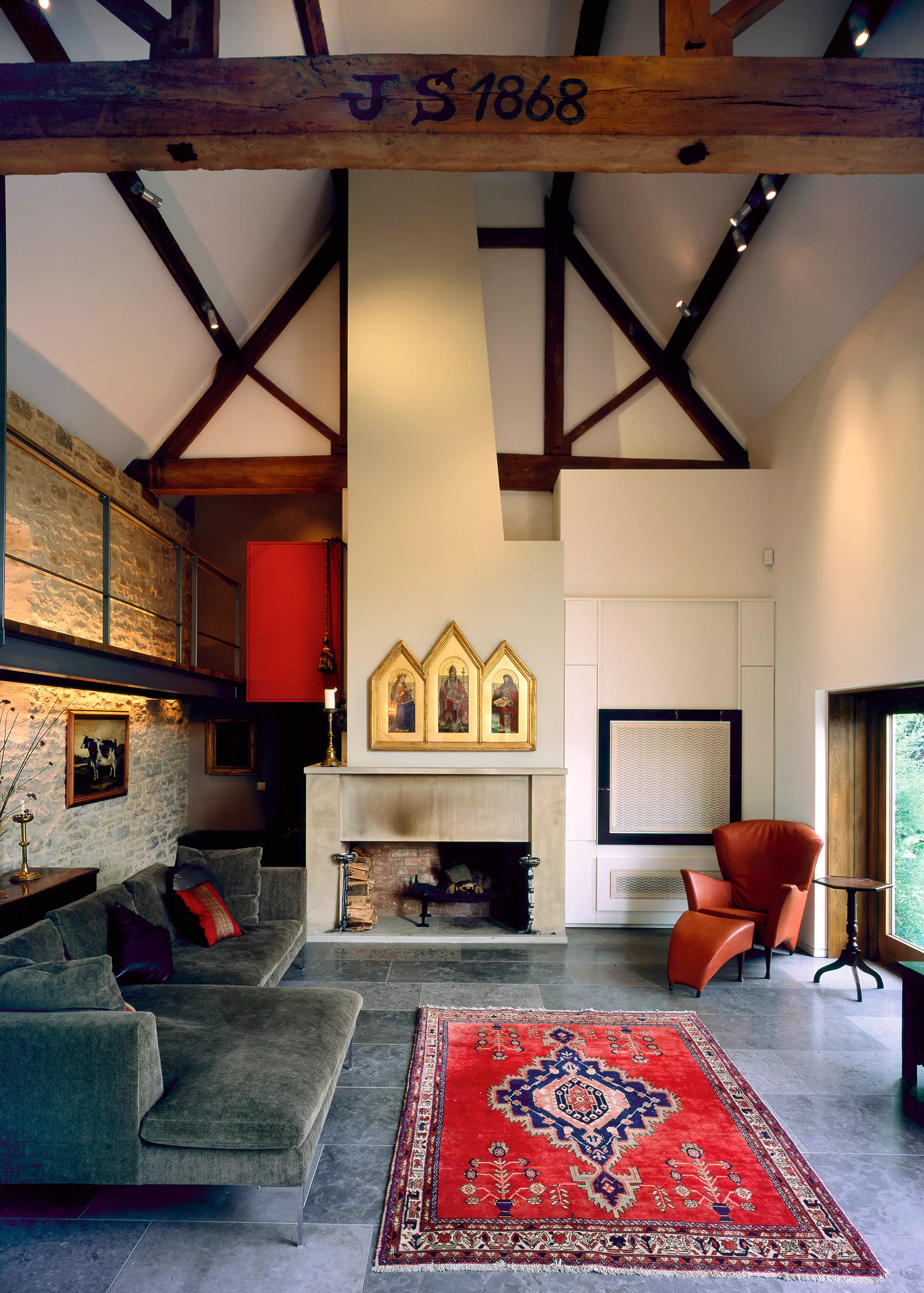 carefully restored barn conversion with exposed stone walls and decorative interior