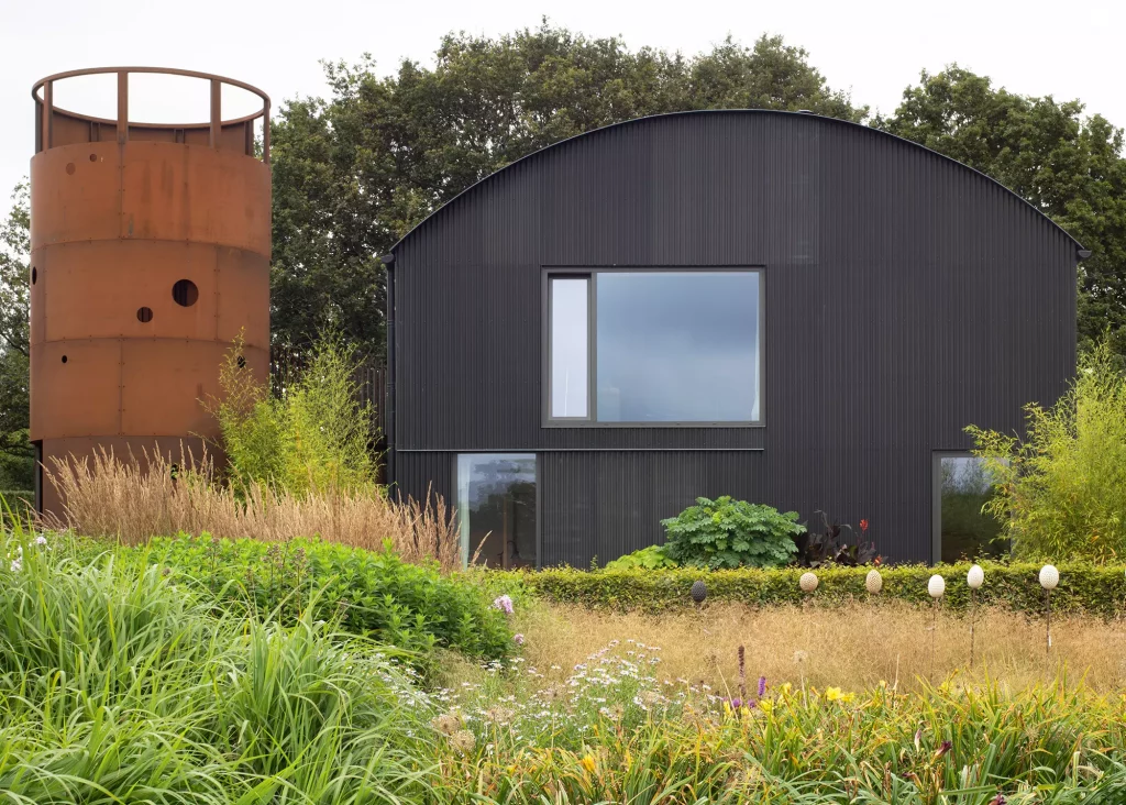 Dutch barn conversion with curved roof