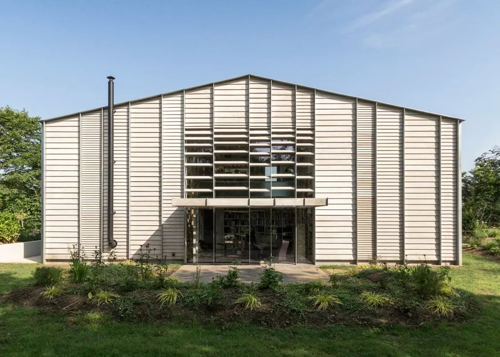 Converted tractor container barn with steel frame and exterior cladding