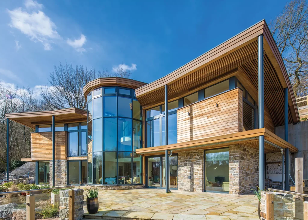 passive house with cladding and statement double-height glazing