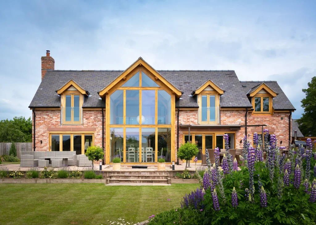 welsh oak frame home with glazed central gable