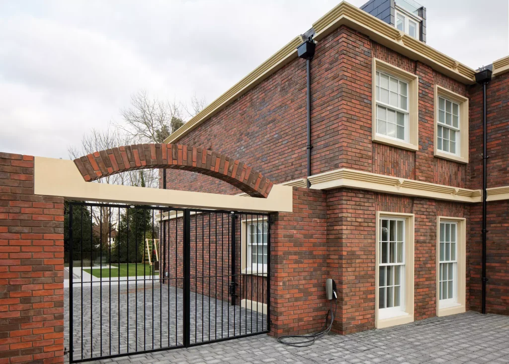 Georgian-inspired home exterior with security gate