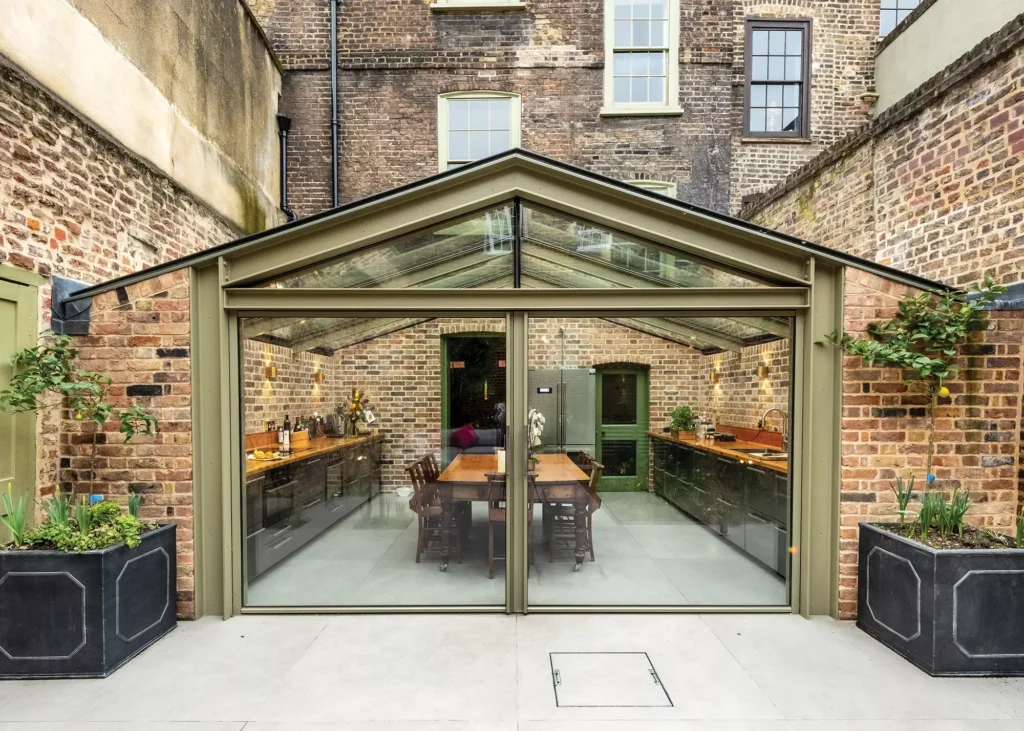 Structurally glazed extension
