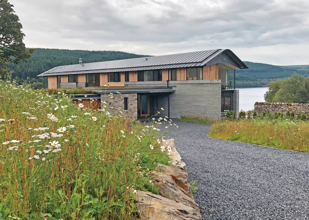 timber frame replacement home looking out over Loch Tummel 