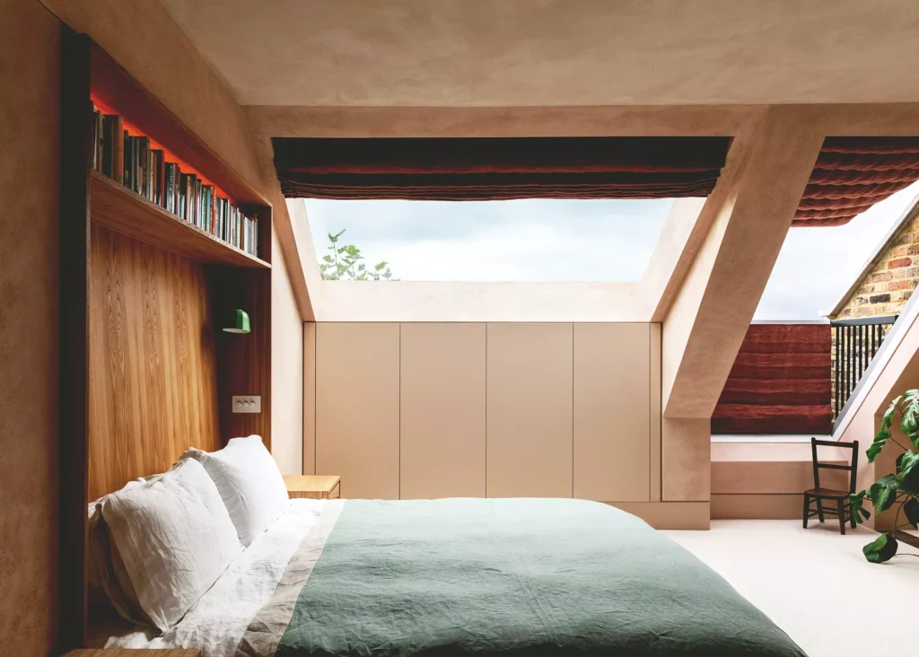 loft conversion with expoed plaster walls and roof windows