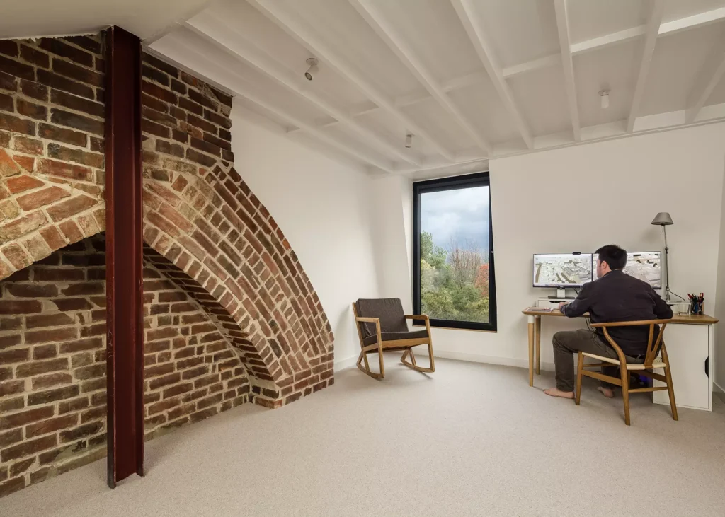 interior of loft conversion with exposed brick wall