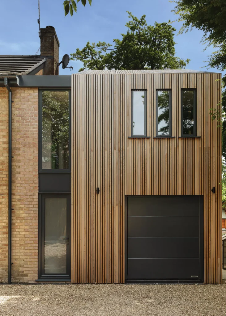 Timber clad extension to a 1970s brick home