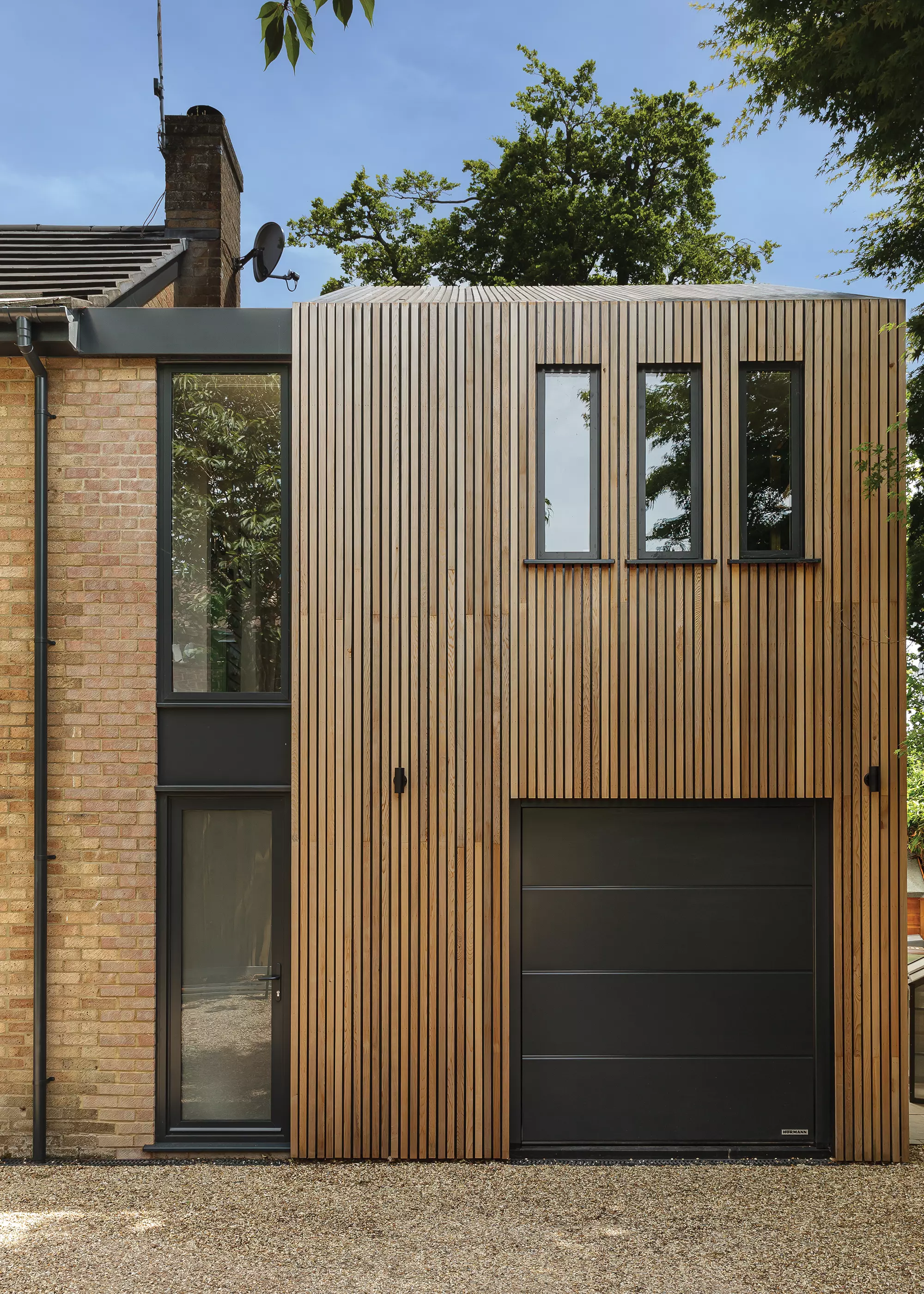 Modern Timber Clad Extension to a 1970s Brick Home
