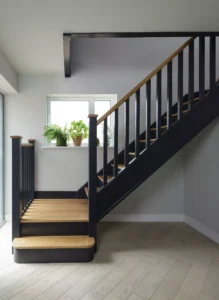 1970s home renovated and extended with a timber clad extension featuring contemporary staircase