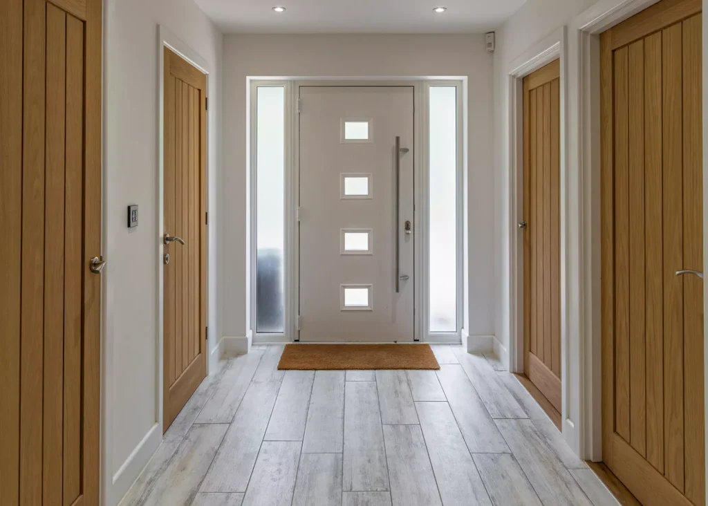 Sleek hallway with contemporary front door