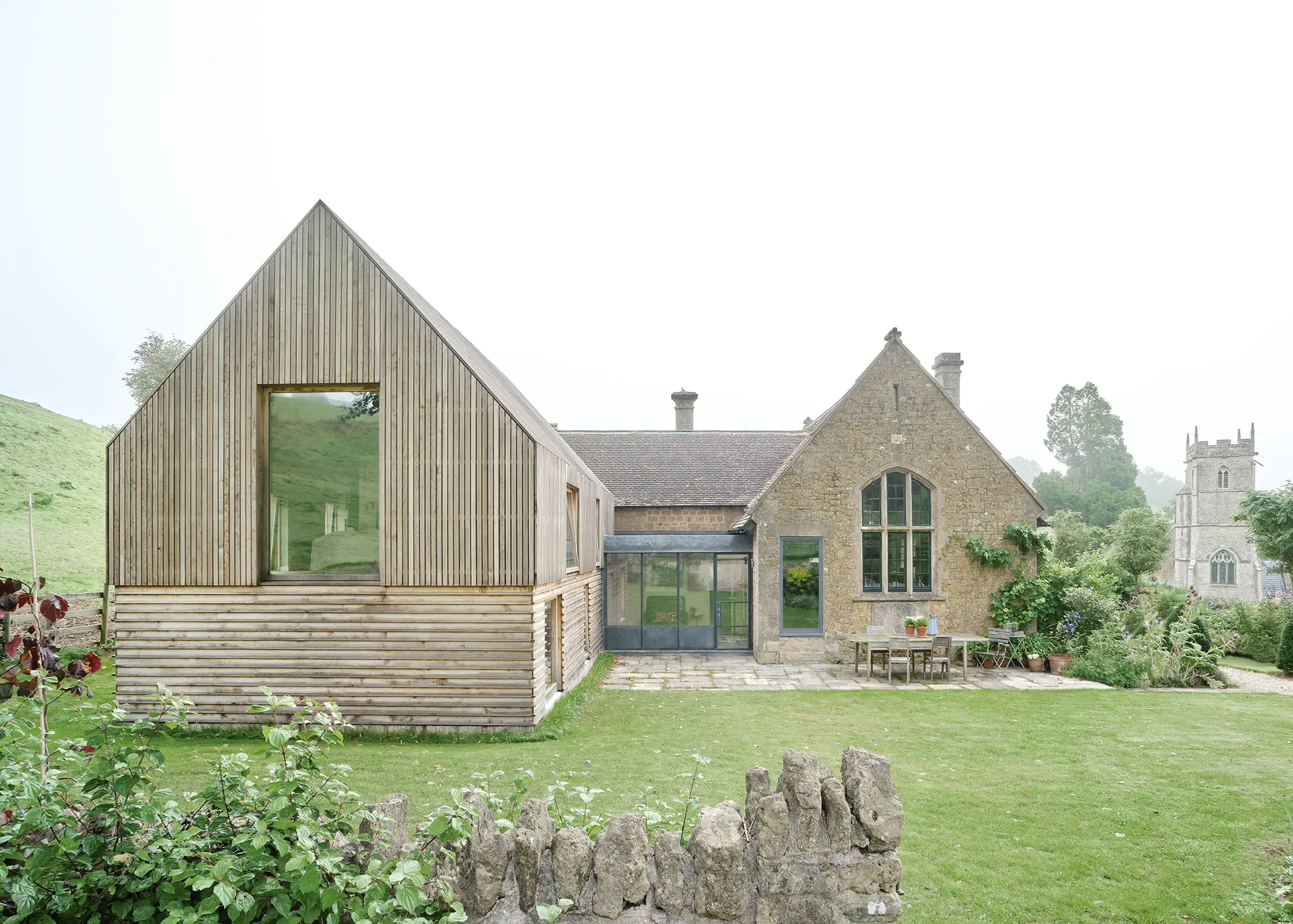 Timber-Clad Two-Storey Extension Linking Old & New
