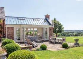 Traditional conservatory extension with bifold doors