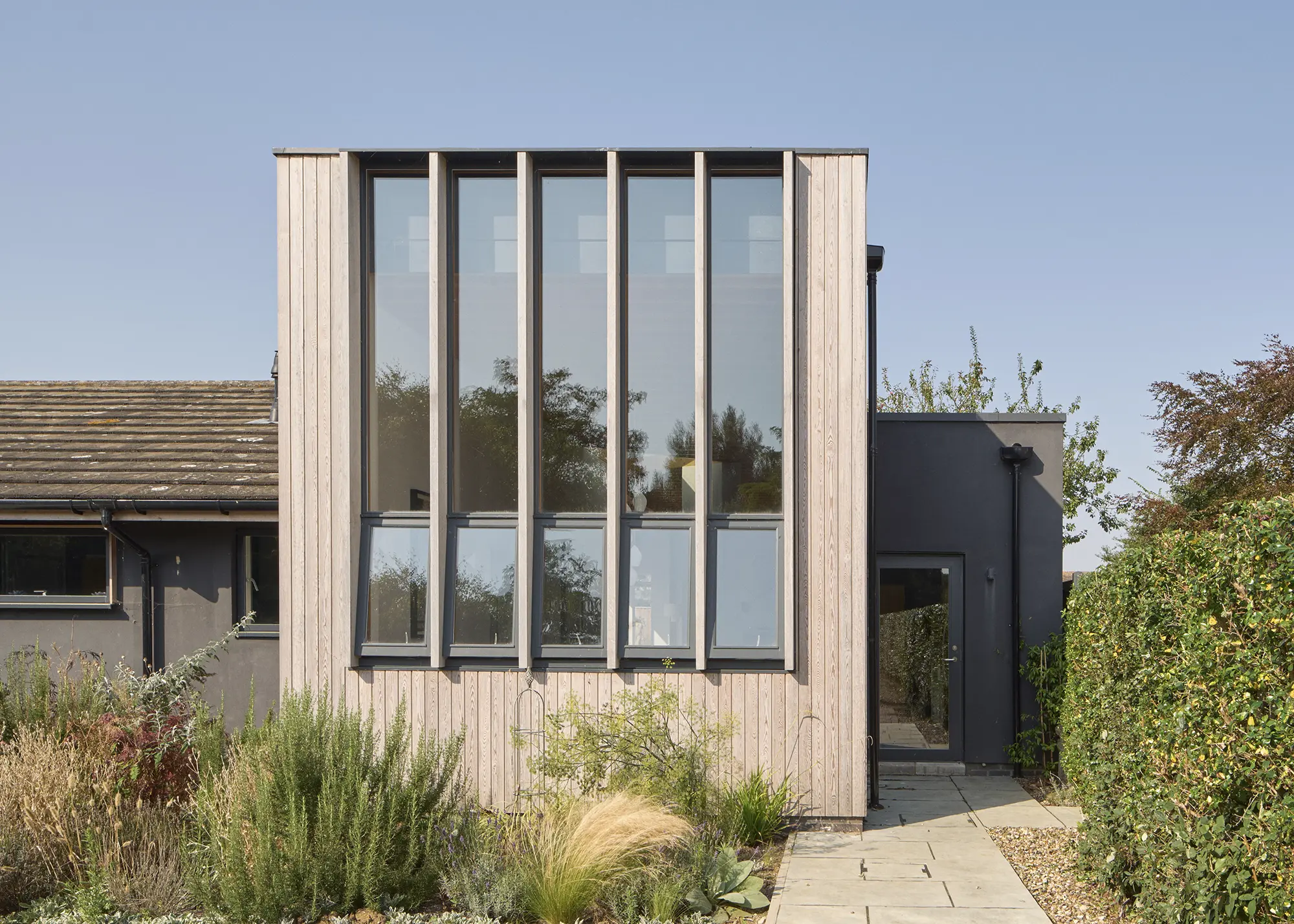 Coastal Bungalow Upgraded with a Striking Timber-Clad House Extension