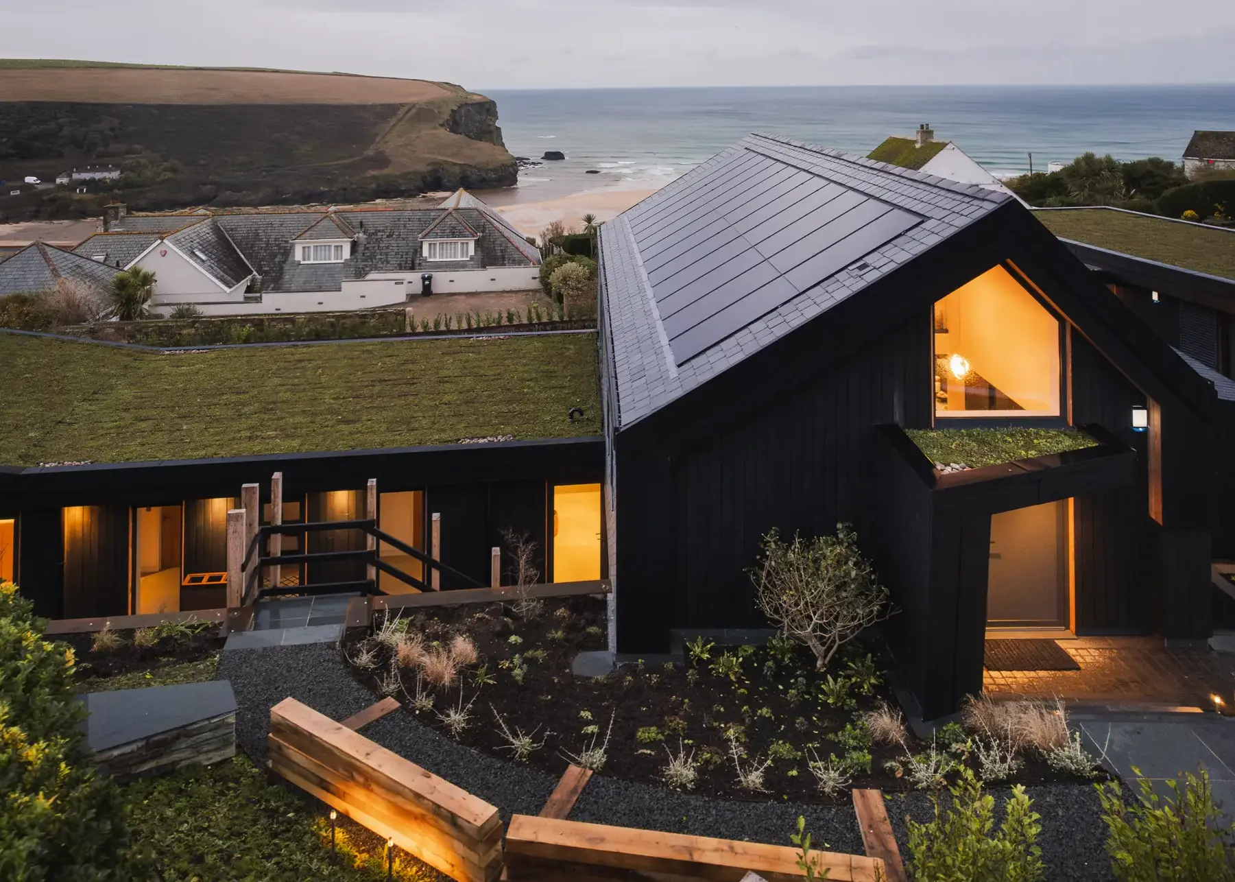 Sustainable coastal home built into a sloping plot