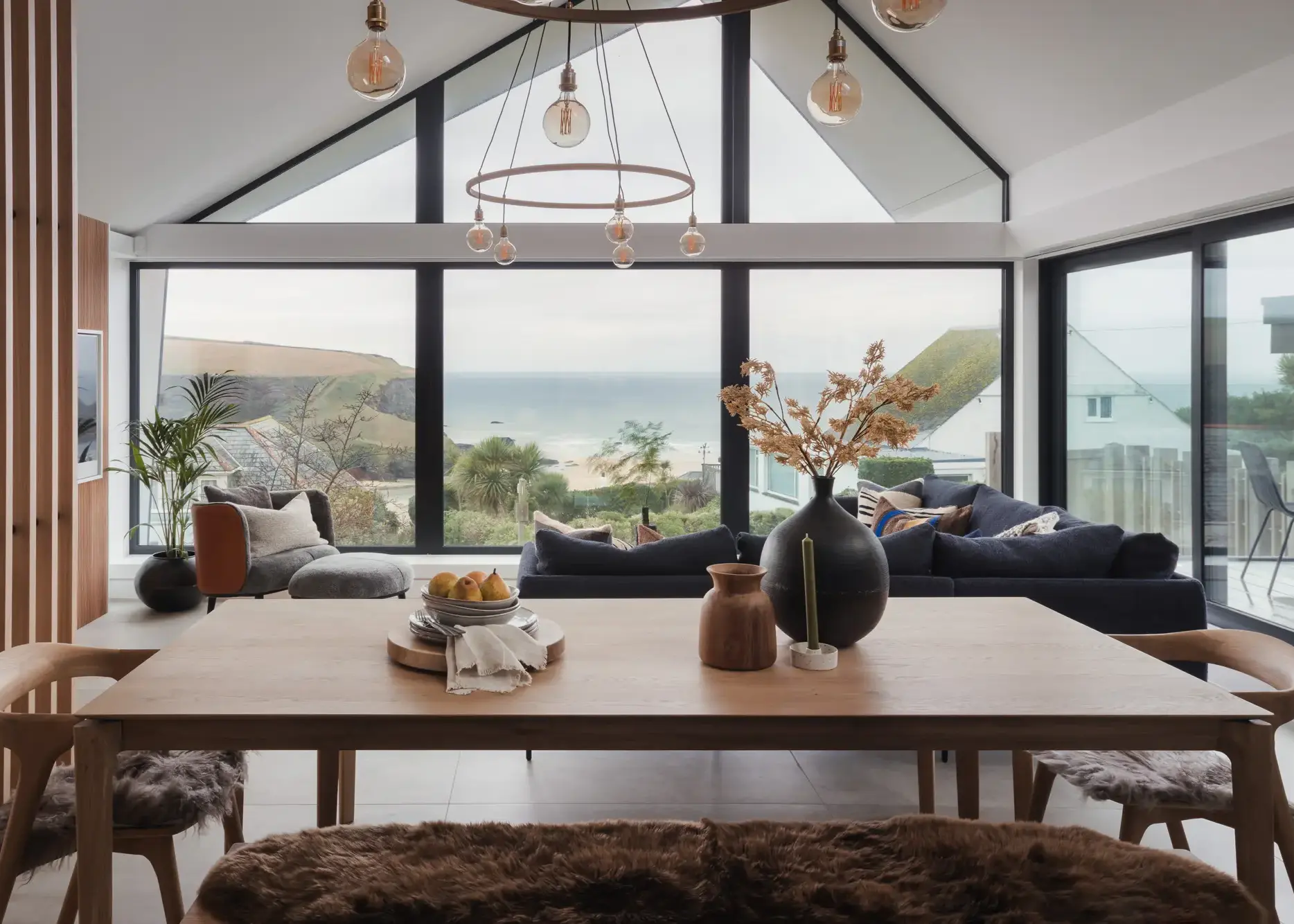 Sustainable coastal home built into a sloping plot