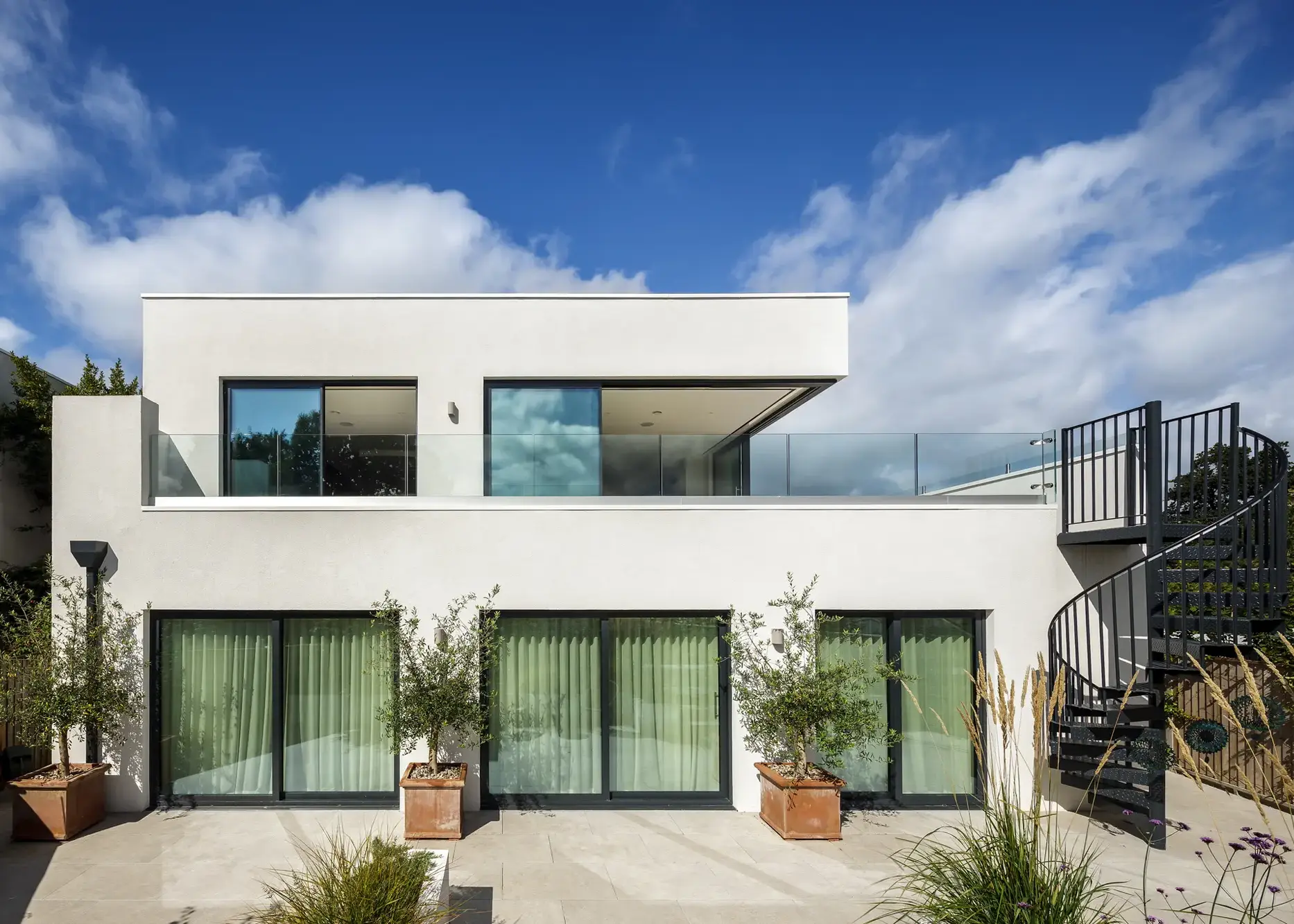 Riverside ICF self build with an open-plan living space on the first floor