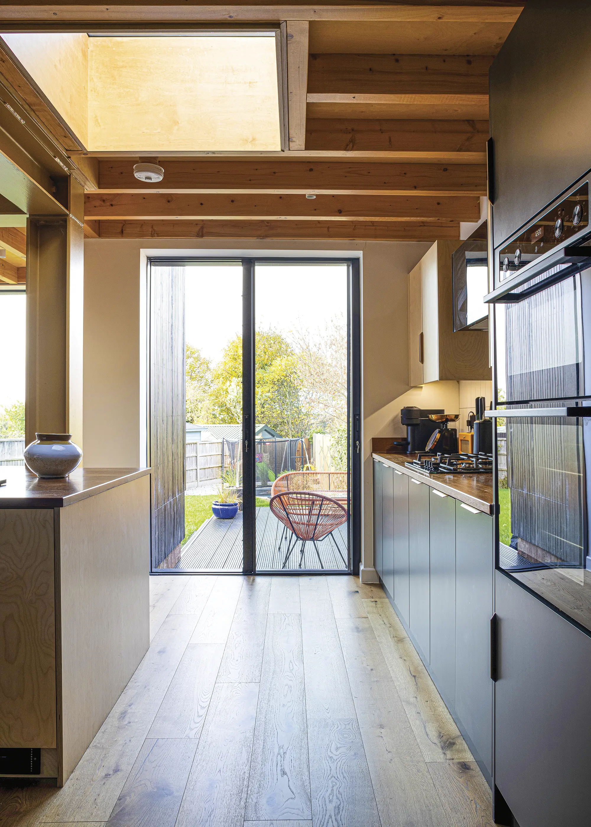 1950s House Opened Up to the Garden with a Timber-Clad Extension