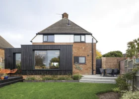 1950s House Opened Up to the Garden with a Timber-Clad Extension