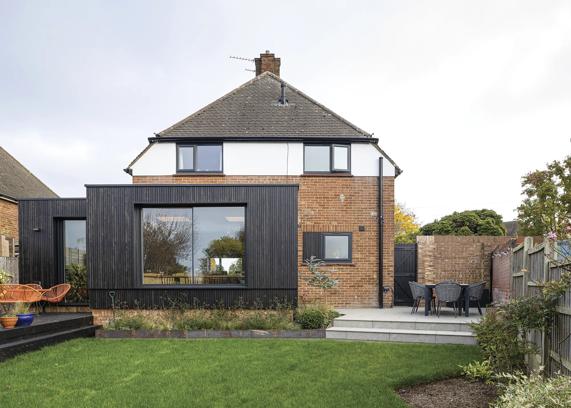 1950s House Opened Up to the Garden with a Timber-Clad Extension