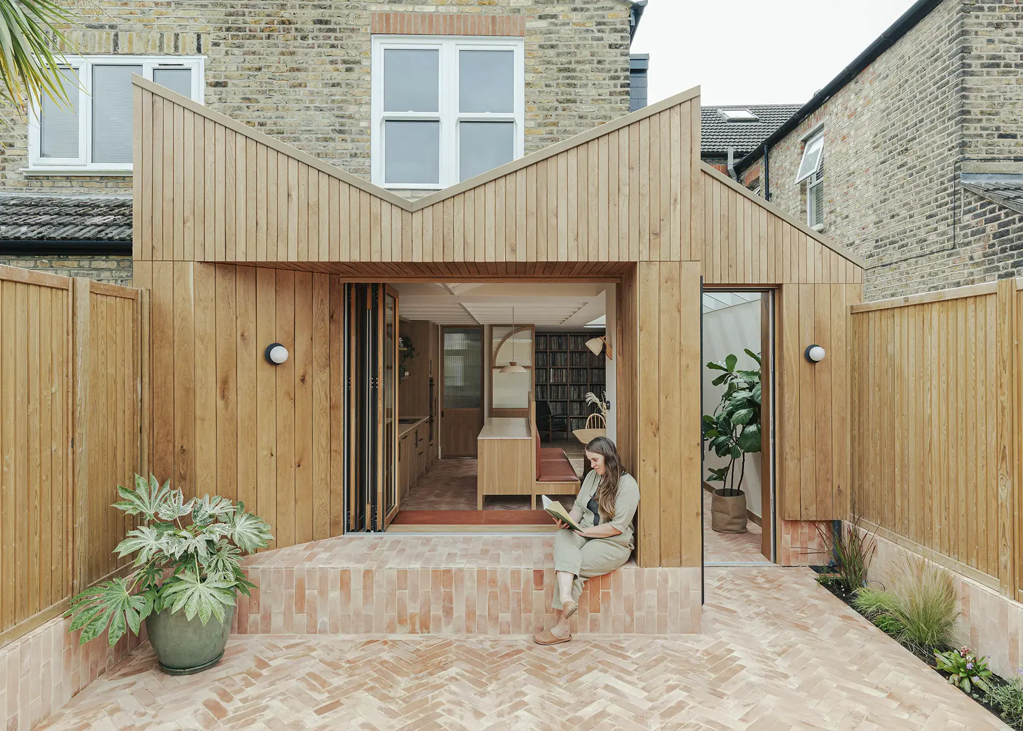 Timber-Clad Kitchen Extension with a Striking Coffered Ceiling